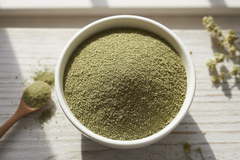 COMFREY LEAF POWDER IN WHITE BOWL AREAL VIEW